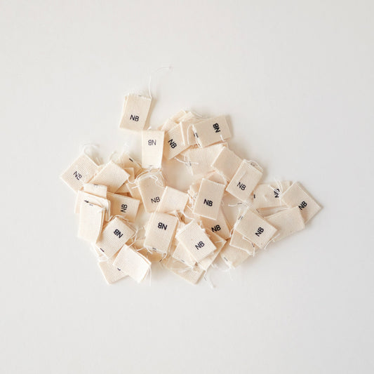Size cotton labels - NB at 24m
