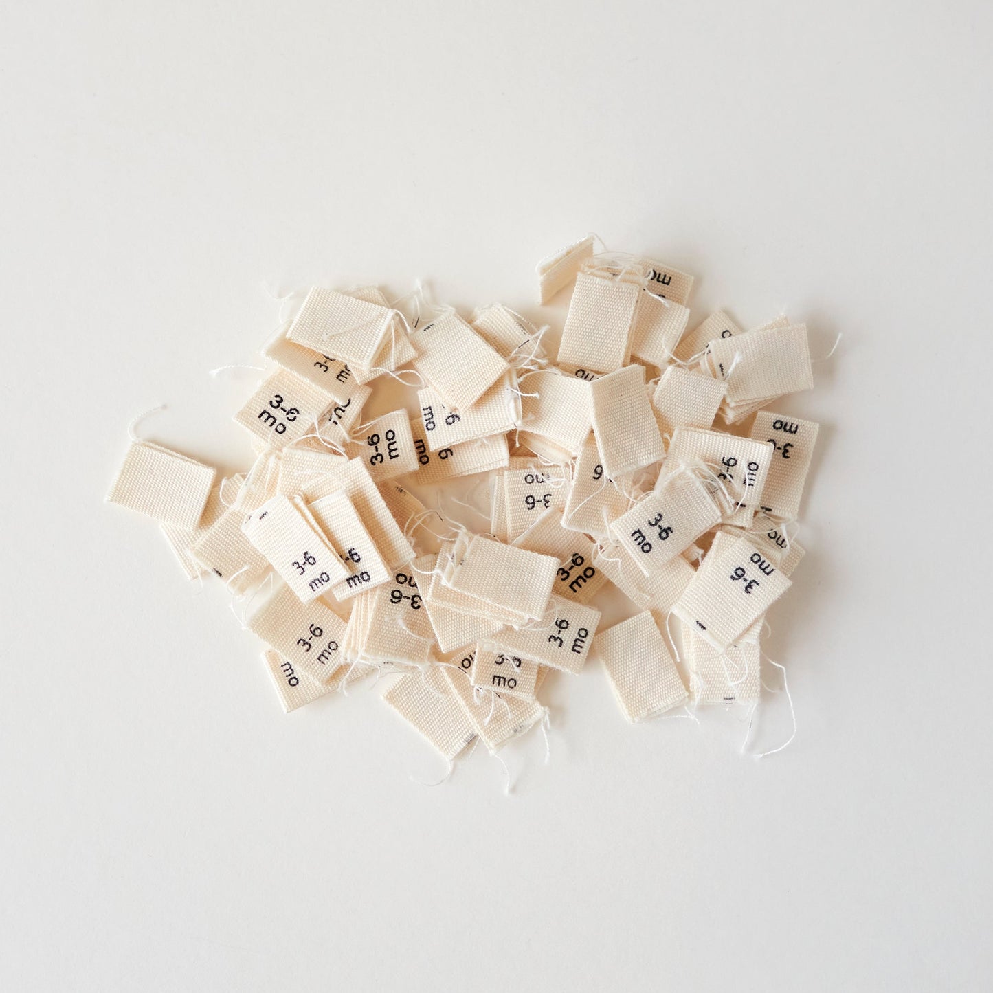 Size cotton labels - NB at 24m