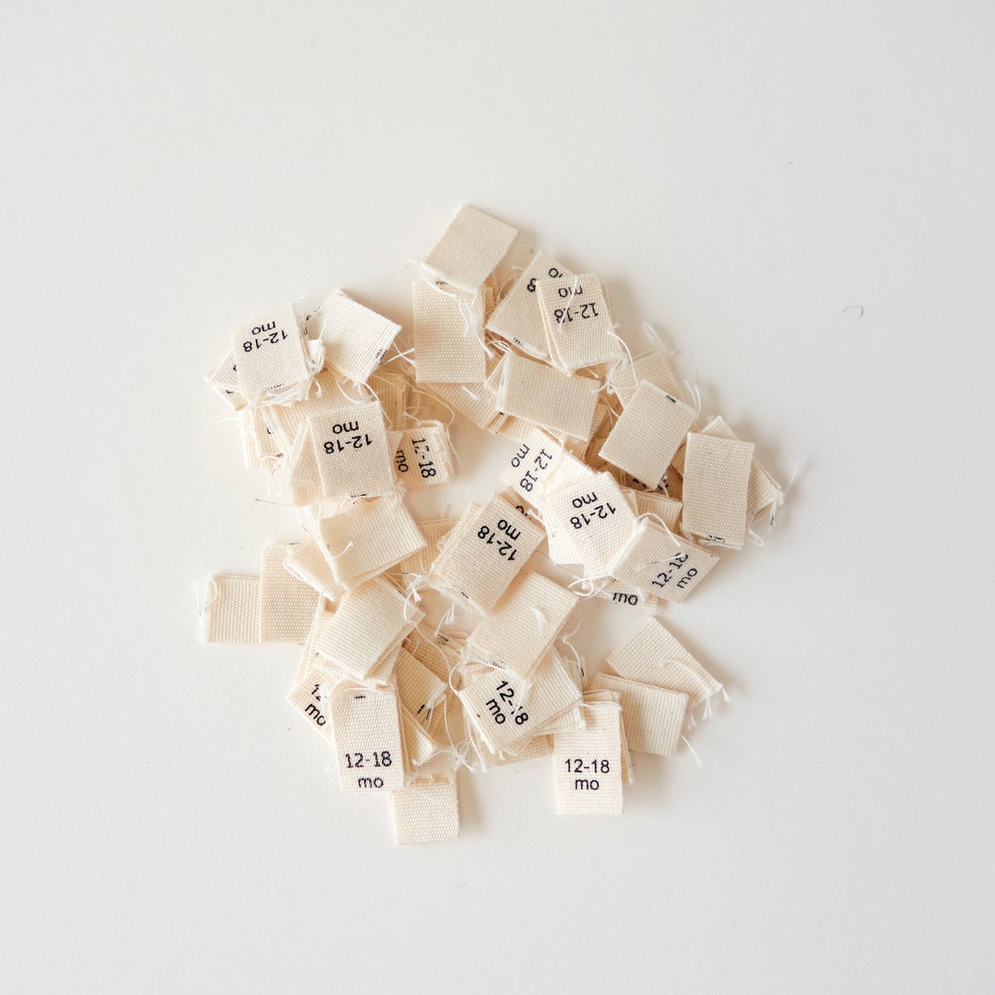 Size cotton labels - NB at 24m