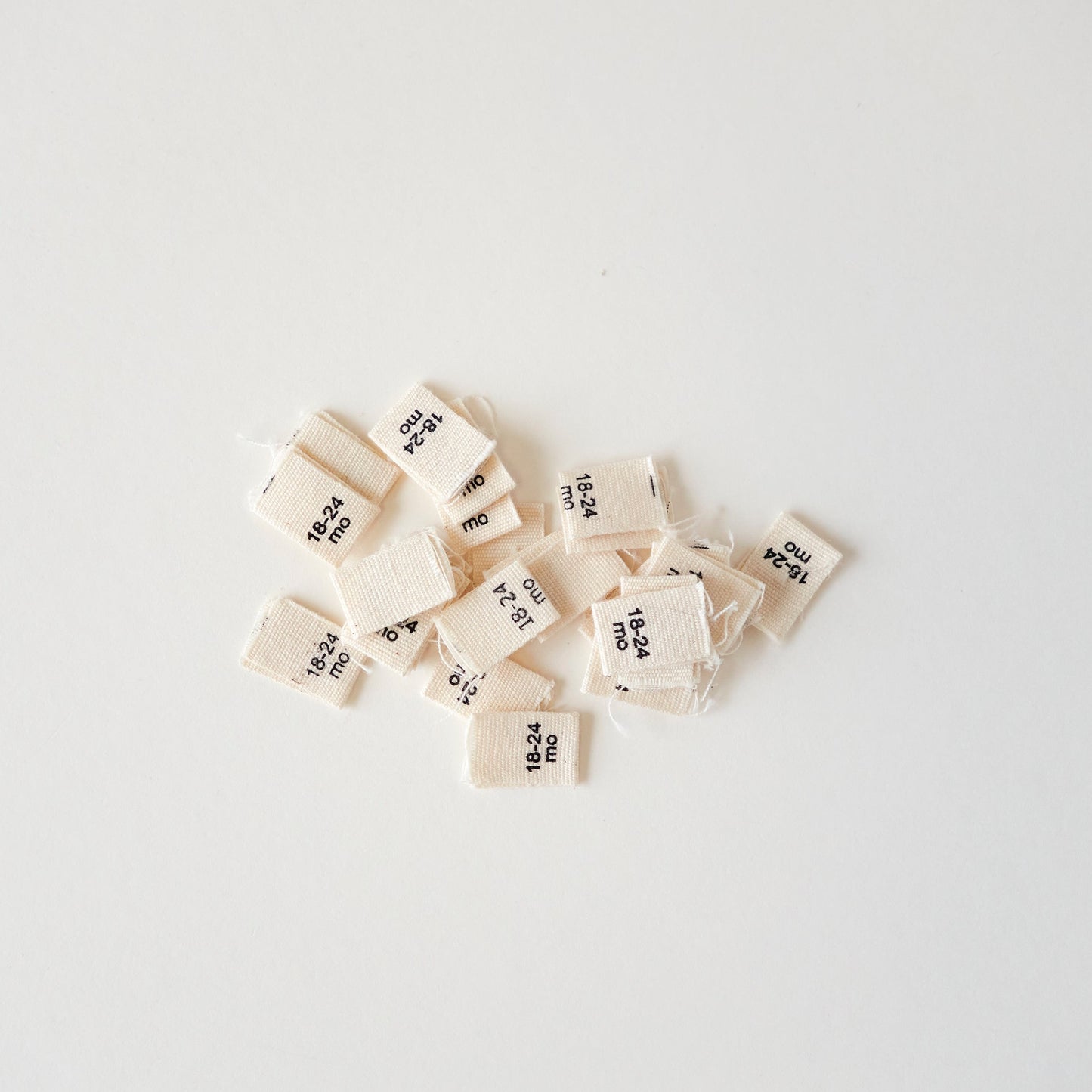 Size cotton labels - NB at 24m