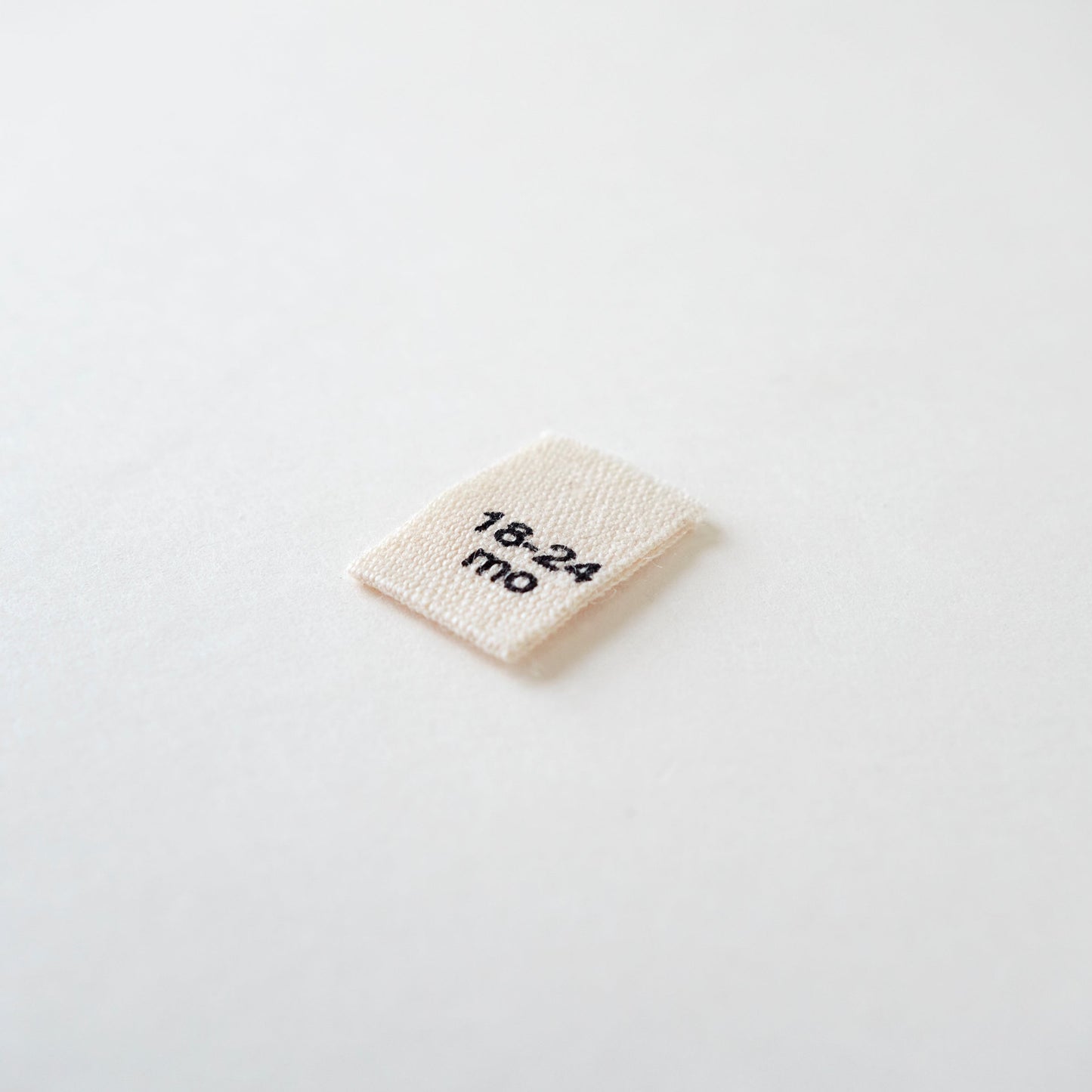 Size cotton labels - NB at 24m
