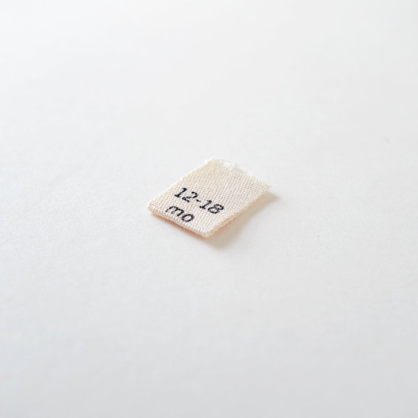 Size cotton labels - NB at 24m