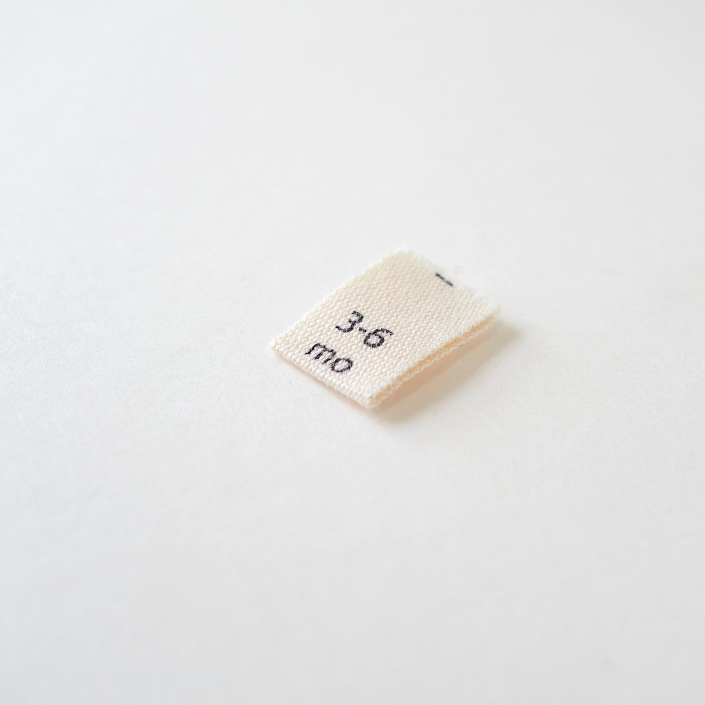 Size cotton labels - NB at 24m