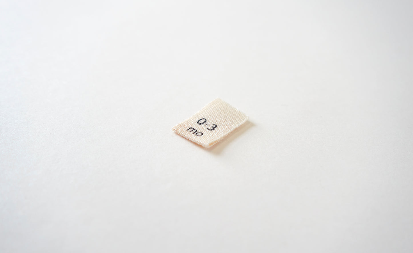 Size cotton labels - NB at 24m