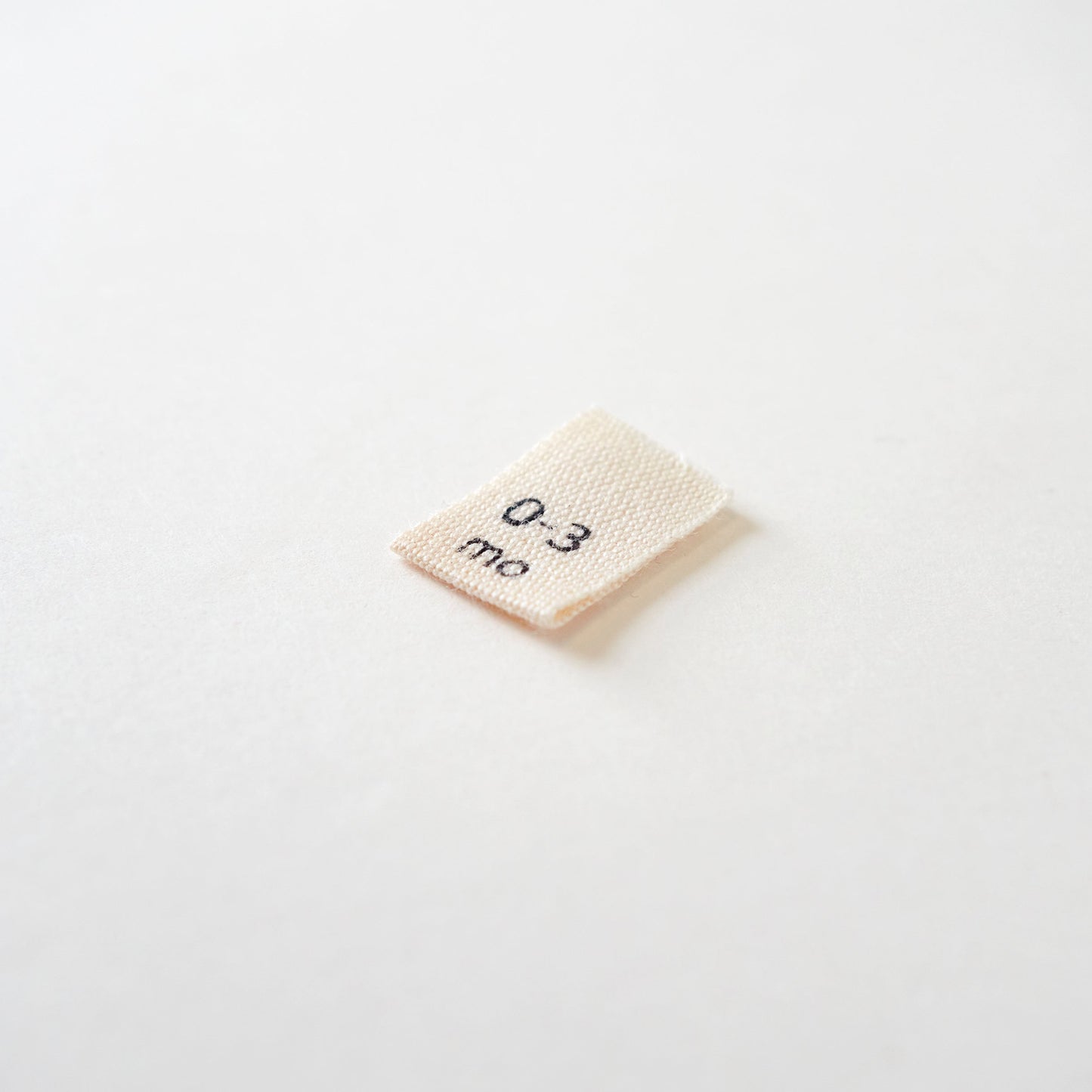 Size cotton labels - NB at 24m