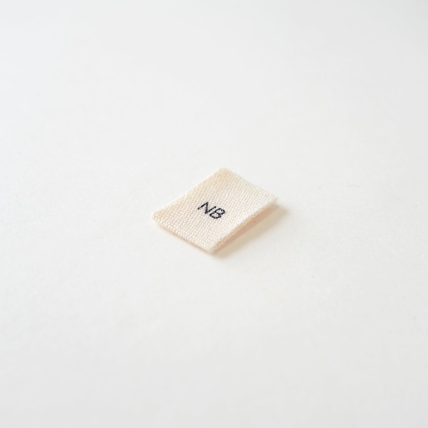 Size cotton labels - NB at 24m