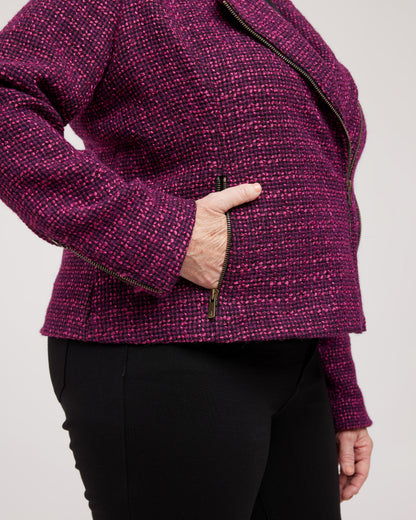 Person wearing a purple textured jacket with a plain background. This biker jacket is the Canton Moto Jacket sewing pattern from Cashmerette.