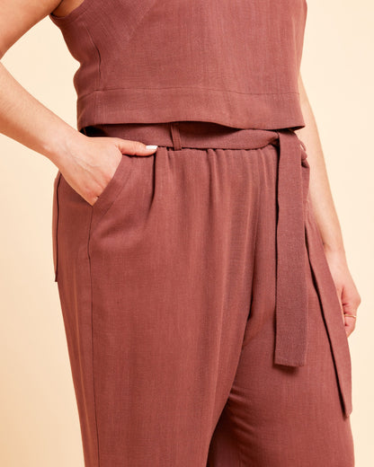 Brown sleeveless top and pants set on a beige background. These pants are the Everett Pants & Shorts sewing pattern from Cashmerette.